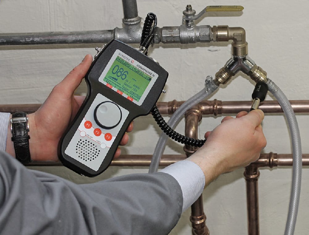Plumber testing pipes with electronic leak detection equipment in Broomfield