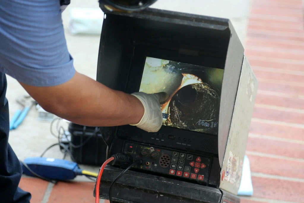Technician viewing a drain inspection camera in Broomfield